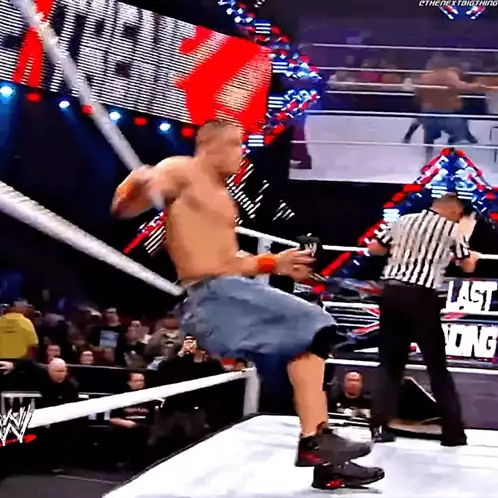 Batista Puts John Cena Through Table in WWE