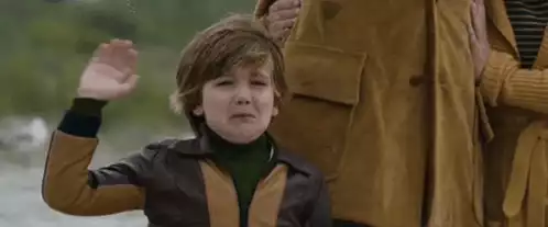 Crying Boy Waving Goodbye