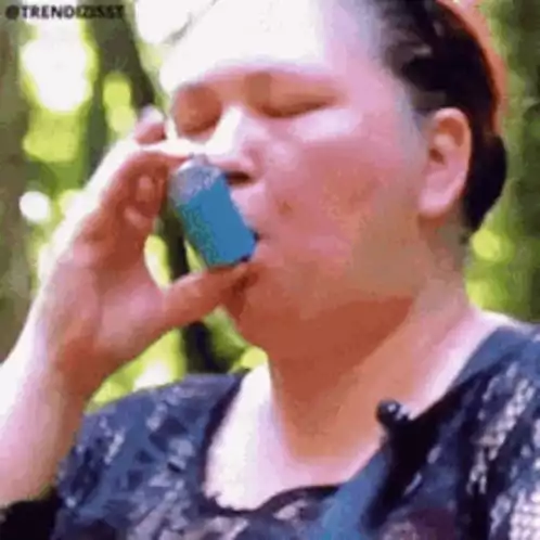 Woman Uses Asthma Inhaler to Breathe