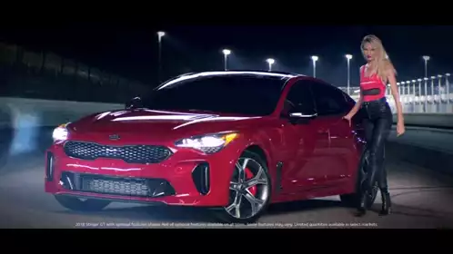 Candice Swanepoel with Red Kia Stinger GT
