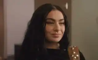 Charli XCX Smiling with Guitar Strap