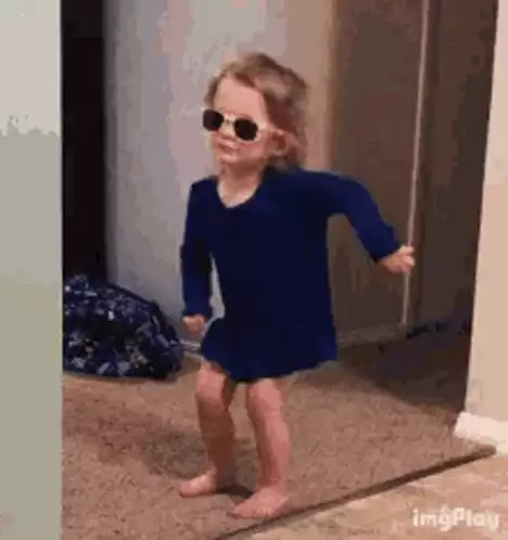 Happy Little Girl Dancing with Shades On
