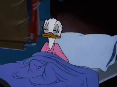 Donald Duck is sleepy in bed