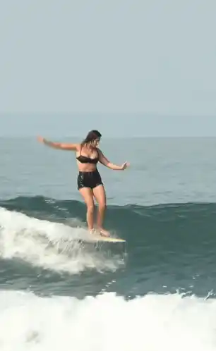 Elise Laine Gracefully Surfing a Wave