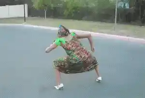 Woman Dancing in Dress and Roller Skates