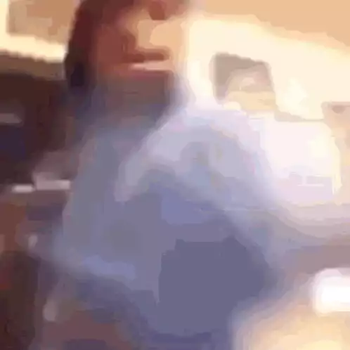Person in Hoodie Punching