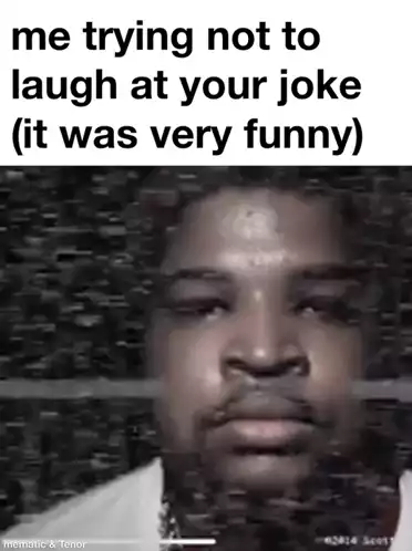 Man Trying Not to Laugh at a Funny Joke