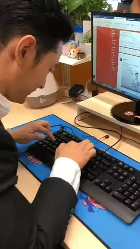 Huangxiaoming Hxm Typing at Desk