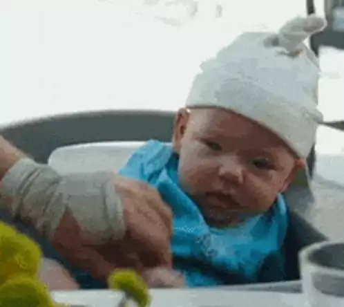 Dazed Baby in White Hat