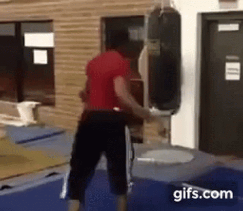 Man Fails Super Round Punch on Sandbag