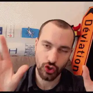 Man Makes Funny Face with Deviation Sign