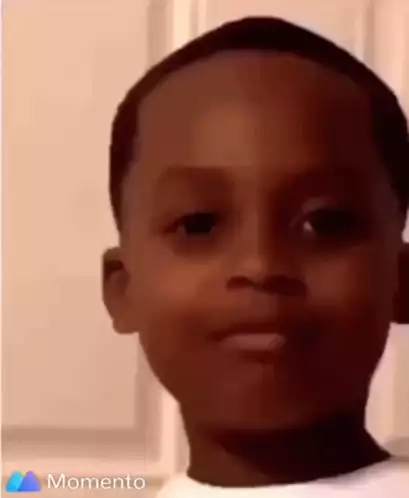 Young Boy Makes Funny Face and Smiles
