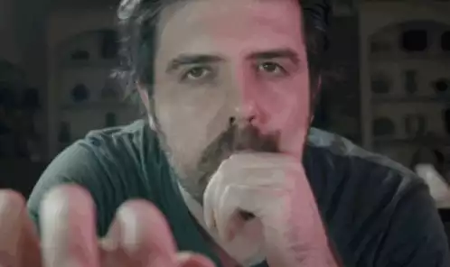 Confused Man Looking at Camera